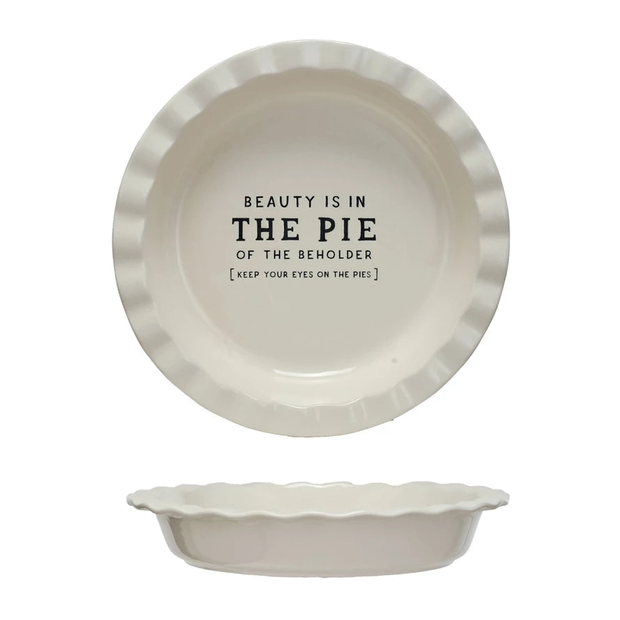 This Round Stoneware Pie Dish, is a celebration of both form and function. Its crisp white surface is emblazoned with the playful saying "Beauty Is In.. THE PIE," making it a conversation starter at any gathering.