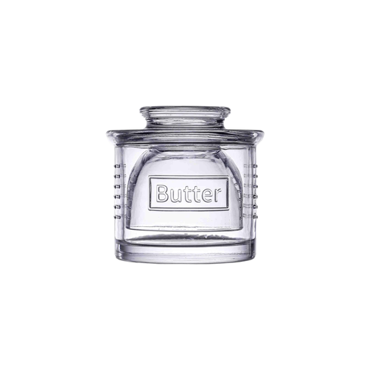 clear glass butter crock on white background