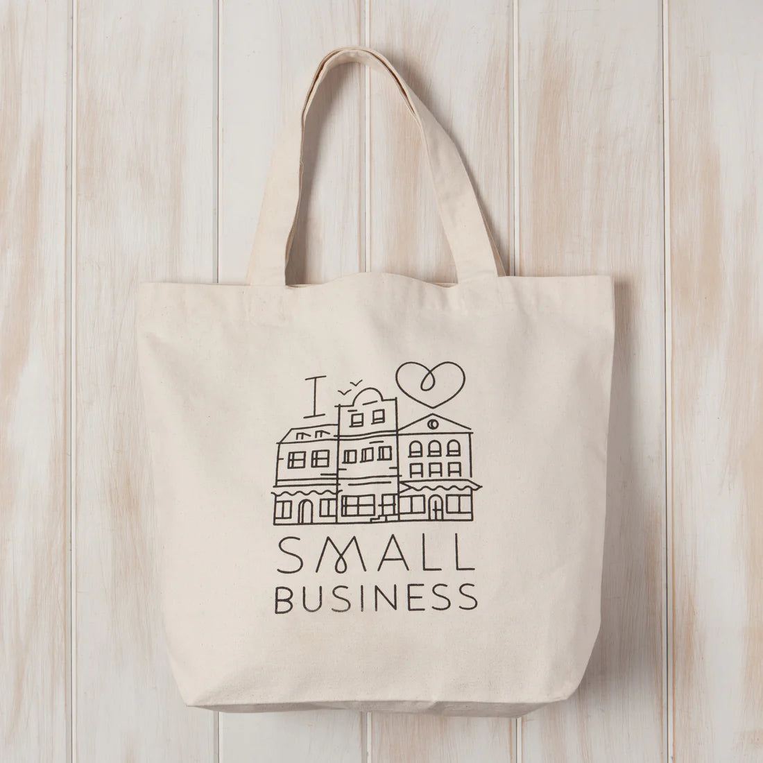 Generous cotton tote bags pack a lot of personality and more. Treasures from the farmer's market, library, or store fit with ease.