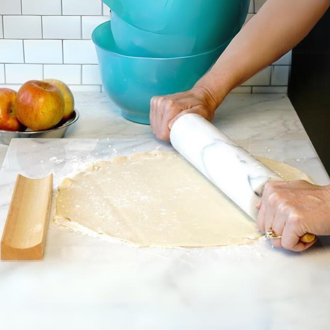 Natural alabaster marble atop polished hardwood handles and stand - an eye-catching addition to any countertop and stows away with ease. Specifically crafted for cool pastry dough, this heavy and efficient design is dependable and beautiful! Roll out the red carpet for the pastry chef in your life! This stunning rolling pin is sure to lend some serious wow to any countertop - all while producing that perfect, flaky crust time and time again.
