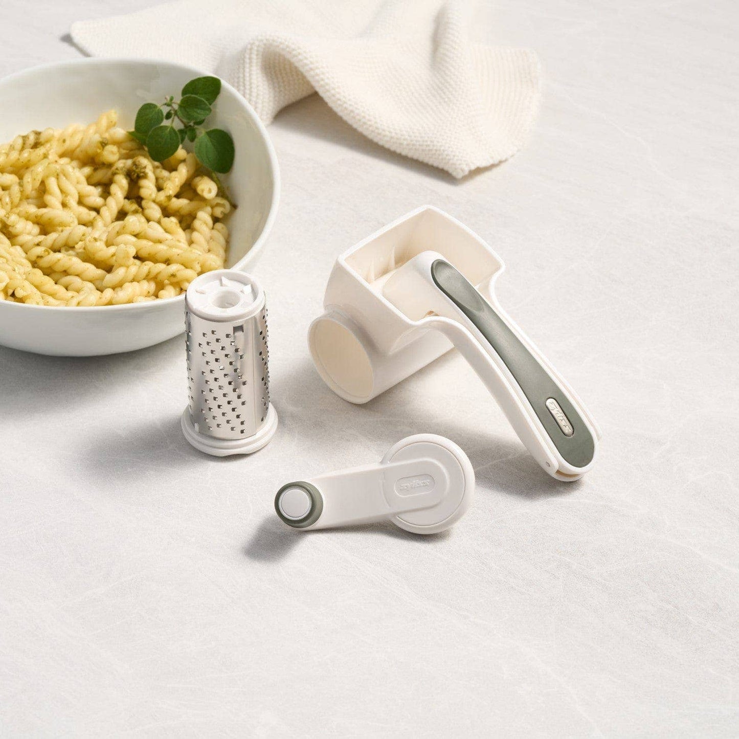 Pasta and kitchen tools on a light surface