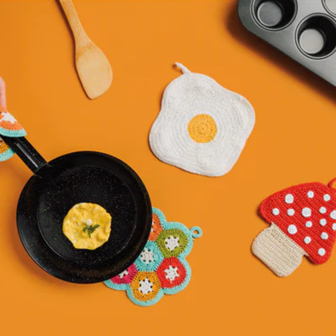 Add a playful touch to your kitchen with the Crochet Egg Trivet, a delightful blend of fun and function. Handmade with care, this 100% cotton trivet is inspired by our joyful collections, bringing warmth and personality to your cooking space.