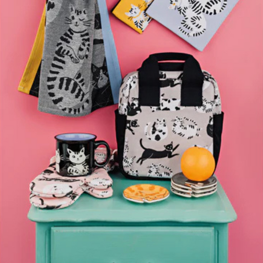 Add a touch of feline charm to your home with the Meow and Furever Trinket Tray. Crafted from durable, food-safe New Bone China, this adorable tray features a white cat with black stripes, making it a delightful accent for any decor.