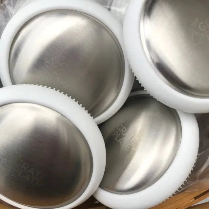 Tackle odors with Odor Steeler: a stainless steel bar of soap to erase sulfur-based smells like garlic, onion, and fish. Includes a silicone scrubber for heavy-duty cleaning. Don't worry, Odor Steeler won't judge!