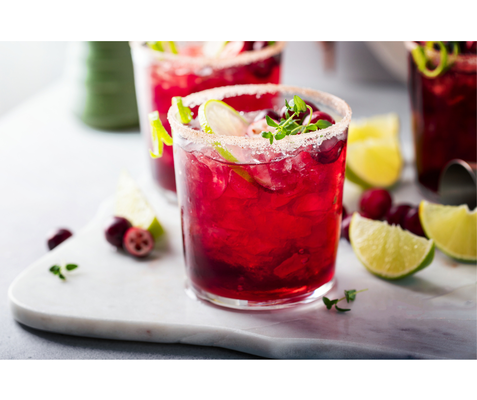 Cranberry margarita made simple with cranberry juice, lime juice, tequila, and triple sec!  Add some frozen whole cranberries to keep your drink festive and extra cold.