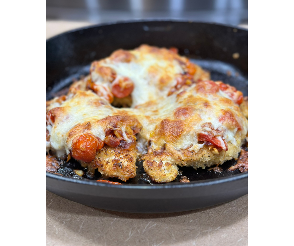 Baked breaded chicken with grape tomatoes, red onion, mozzarella and served with a side of butter noodles.