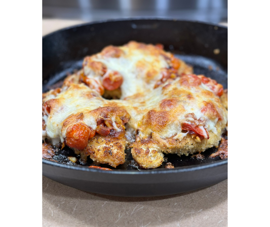 Baked breaded chicken with grape tomatoes, red onion, mozzarella and served with a side of butter noodles.