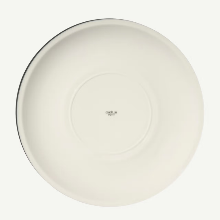 White ceramic plate with 'made in' text on a white background