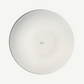 Round white object with 'made in' text on a white background
