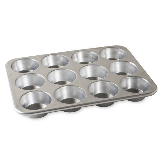 Nordic Ware's top-rated Naturals® Bakeware collection is made of pure aluminum for superior heat conductivity and produces consistent evenly browned baked goods every time. These premium pans are designed for lifetime durability and will not rust. Encapsulated galvanized steel rims prevent warping. Creativity meets natural aluminum sustainability. Serve up something special with this eco-friendly solution that doesn't skimp on performance