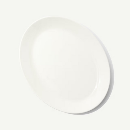 White ceramic plate on a light gray background