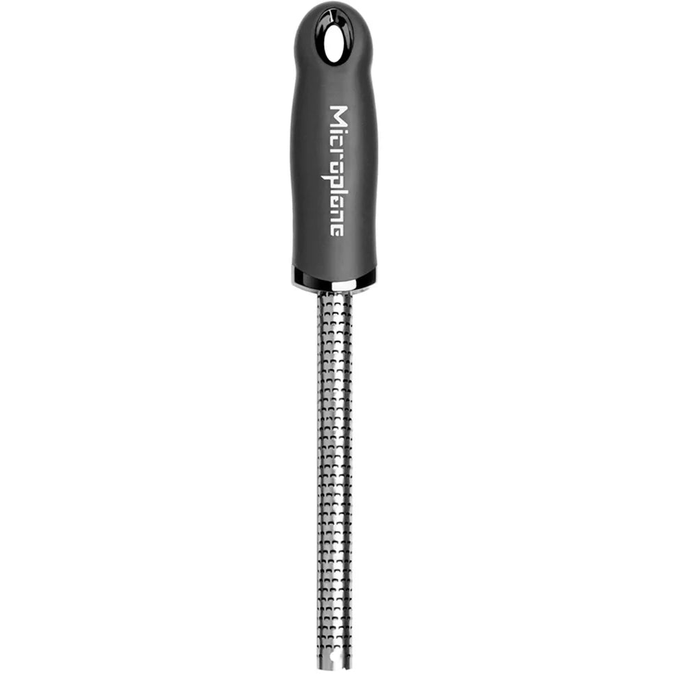 Micropplane grater with black handle on a white background