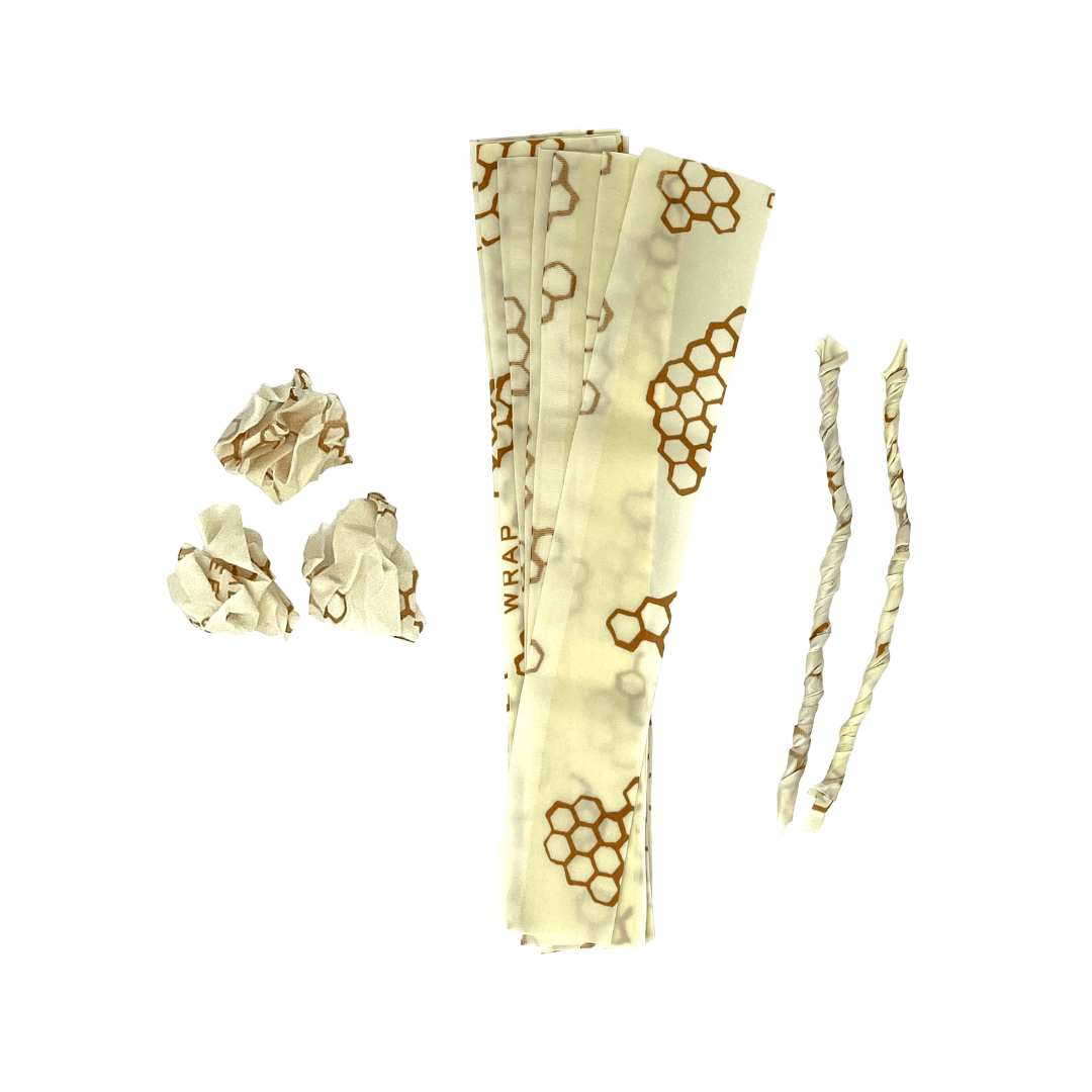 Beige beeswax wraps with honeycomb pattern on a white background