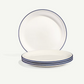 Set of white plates with blue rims and stripes on a white background