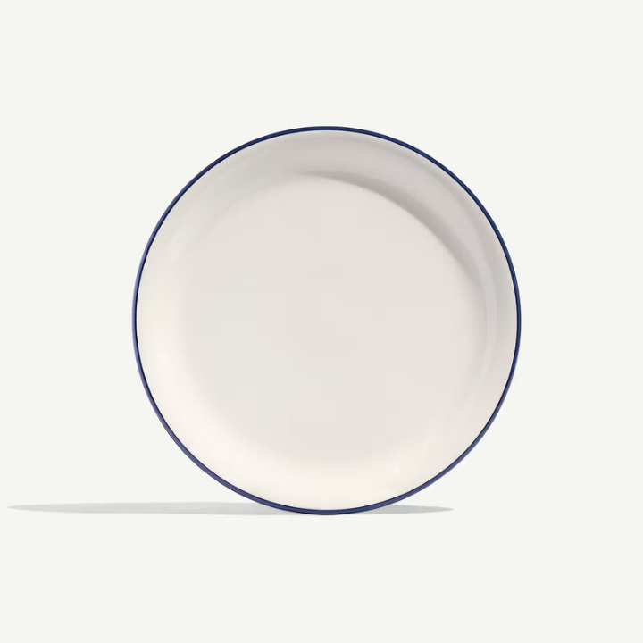 White plate with a blue rim on a white background