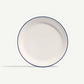 White plate with a blue rim on a white background
