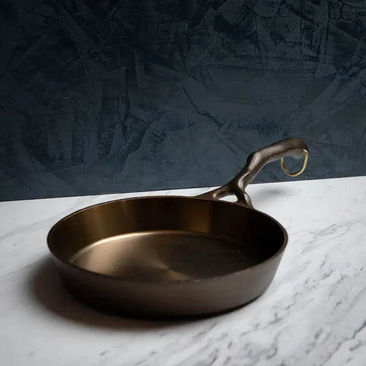 Most valuable, most versatile, most comfortable. From steak to apple pie, this 9" cast iron skillet can do it all, while being the most gorgeous piece in your kitchen.   The handle on this 9" skillet has been called the most comfortable available on a cast iron skillet, meticulously sculpted to fit both left and right hands of every size. More length makes for better balance, and also keeps things cooler for longer.