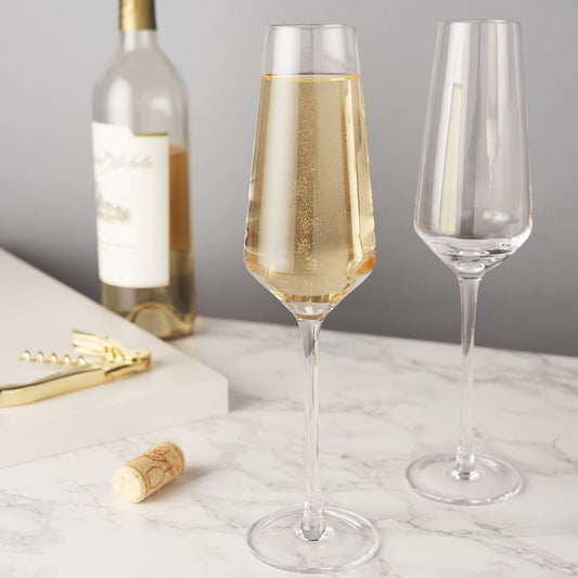 An angled base, faceted diamond design, and perfectly clear crystal give this set of champagne flutes otherworldly sparkle. Add contemporary glam to your Prosecco, champagne cocktails, and mimosas with this stemmed glassware.