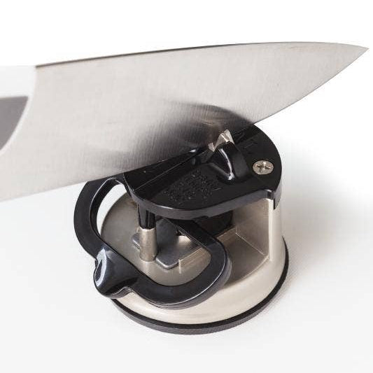 Knife sharpener with a knife on a white background