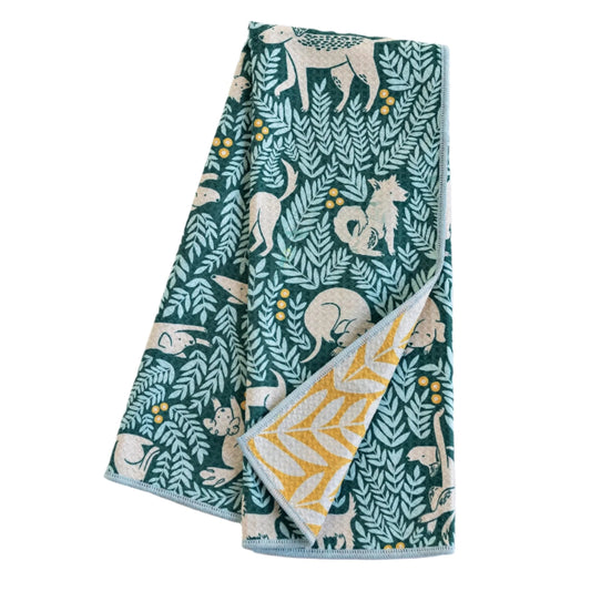 Calling all dog lovers! Get ready to wag your tails with excitement over the Dog Park Print Towel Collection. The lush teal ground print with pops of yellow is adorned with playful pups, giving your home a burst of energy and happiness. The reverse is an inspirational bold leaf print on a sunny yellow ground.