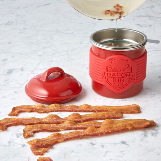 Red 'Bacon Bin' container with bacon strips on a marble surface
