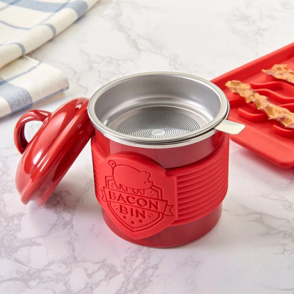 Red 'Bacon Bin' container with a silver lid on a marble surface.
