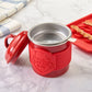 Red 'Bacon Bin' container with a silver lid on a marble surface.