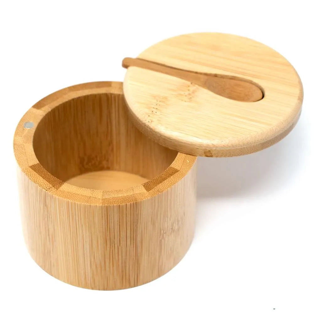 A round bamboo container with a matching lid and a small wooden spoon, shown open on a plain white background.