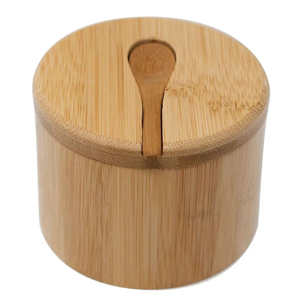 A round bamboo container with a matching bamboo lid and a small bamboo spoon resting in the center, shown on a plain white background.