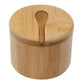 A round bamboo container with a matching bamboo lid and a small bamboo spoon resting in the center, shown on a plain white background.