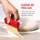 Hand using a red brush to clear flour from a surface with text promoting efficient cleaning.