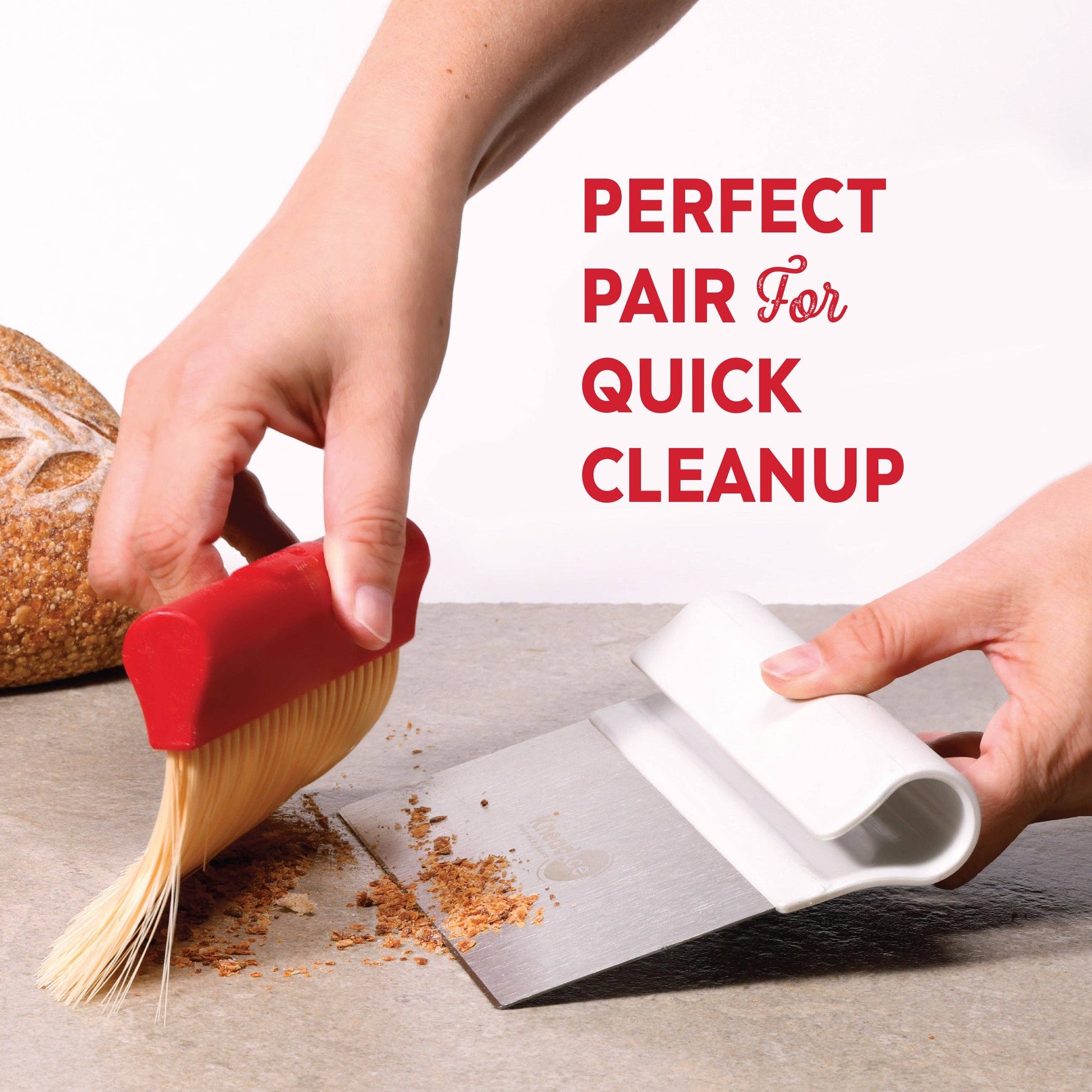 Person using a red brush and white刮板 to clean up crumbs on a surface with text 'Perfect Pair For Quick Cleanup'.