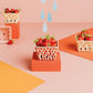 Baskets with strawberries on a colorful geometric background