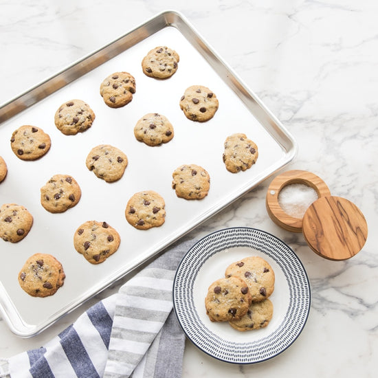 Make large batches of cookies and bars with this extra large sheet pan. Fits most standard size ovens. 35% larger surface than the half sheet! The Nordic Ware commercial-duty Naturals® Bakeware is made of even-heating, rust-proof aluminum and features a galvanized steel encapsulated reinforcement around the rims for added strength. 
