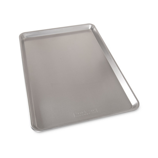 Make large batches of cookies and bars with this extra large sheet pan. Fits most standard size ovens. 35% larger surface than the half sheet! The Nordic Ware commercial-duty Naturals® Bakeware is made of even-heating, rust-proof aluminum and features a galvanized steel encapsulated reinforcement around the rims for added strength. 