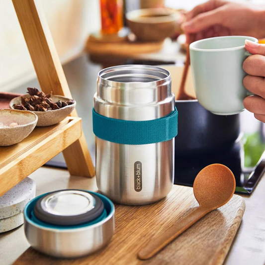 Travel Soup Container with spoon on a counter