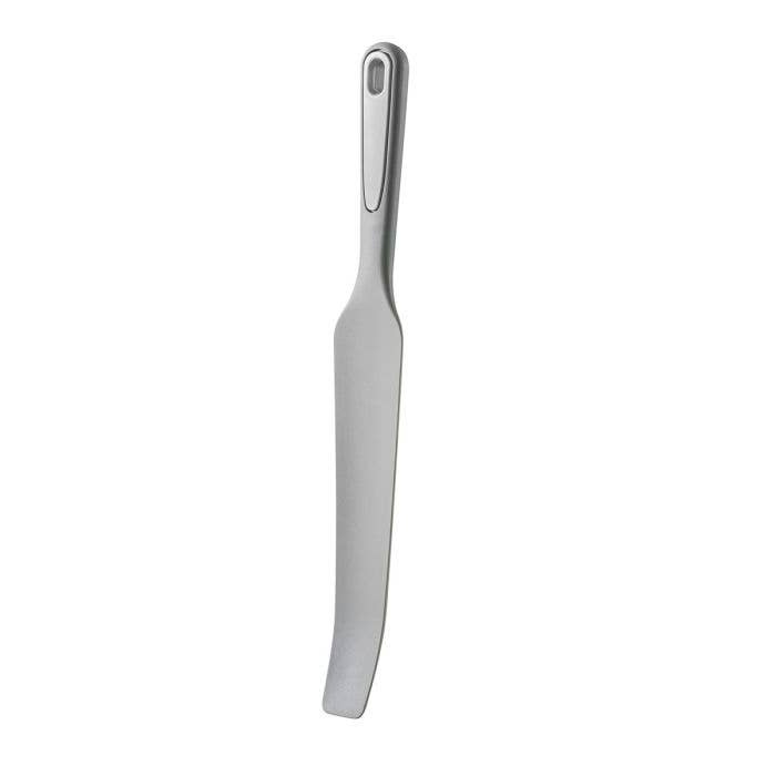 gray silicone kitchen spurtle with a gray handle on a white background