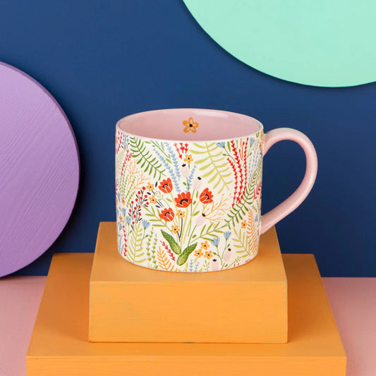 Bouquet Mug! Adorned with a cheerful wildflower pattern on the outside and a lovely pop of pink on the inside