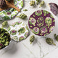 Decorative plates with artichoke pattern on a marble surface