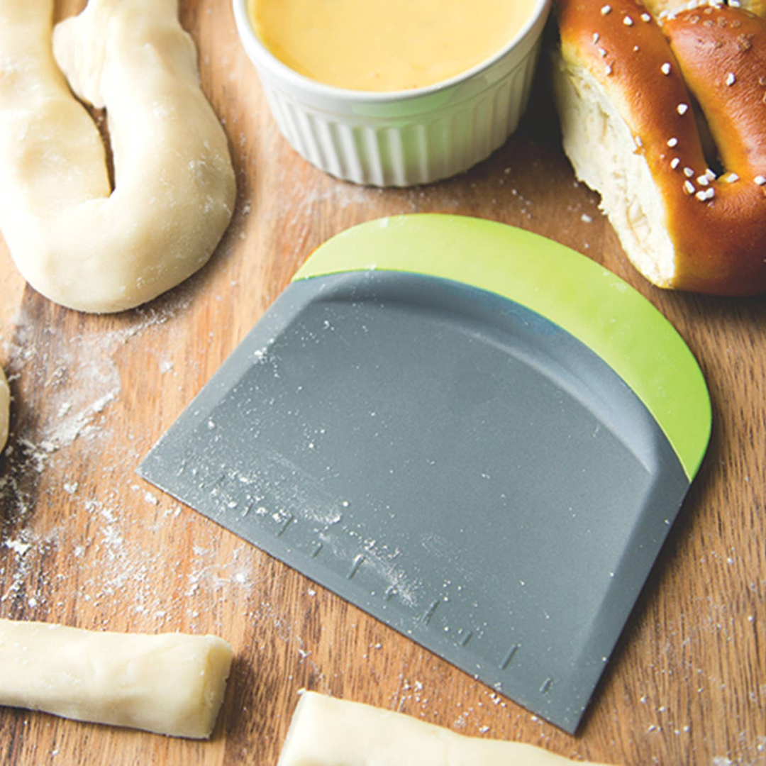 effortlessly cut, scrape, and measure with the Fox Run 3-in-1 Bowl Scraper! This versatile kitchen tool features a durable, straight-edged plastic cutter for precise dough cutting, while the opposite end boasts a curved, lime green silicone scraper—perfect for cleaning mixing bowls and countertops. Measurement markings allow you to easily check the size of your rolled-out dough.