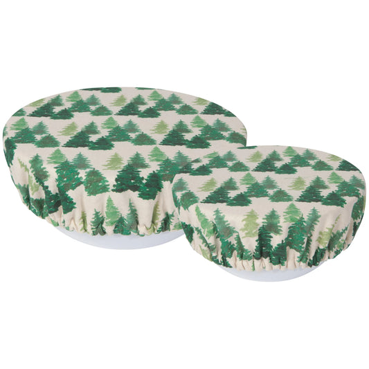 Two round cushions with green tree pattern on a white background