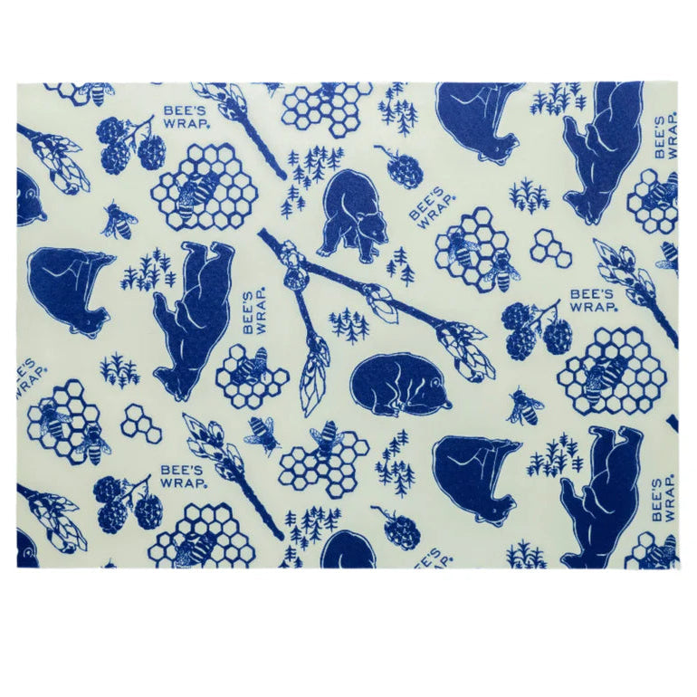 Bees wrap with blue bear and honeycomb pattern on a white background