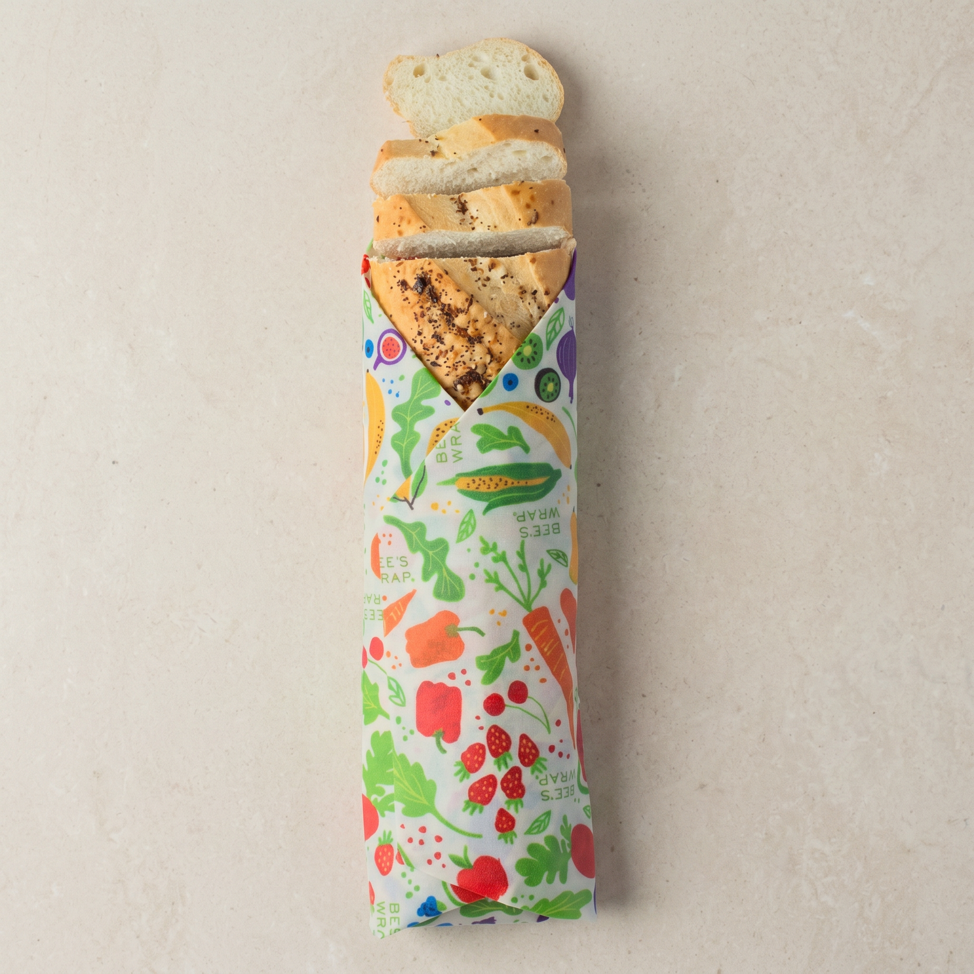 Bread stick with colorful packaging featuring vegetables on a beige background