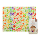 Colorful beeswax wrap with vegetable pattern and branded packaging on a white background