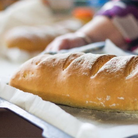 Loaf of bread on a tray with a blurred background