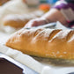 Loaf of bread on a tray with a blurred background