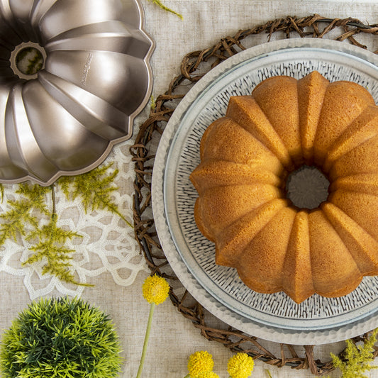 The original beloved Nordic Ware bundt design bakes elegant, picture-perfect cakes with ease in a shape loved by millions. Made of cast aluminum and a copper touch finish. This classic pan will make beautiful desserts that are sure to be conversation starters— with just the right splash of 50s nostalgia!