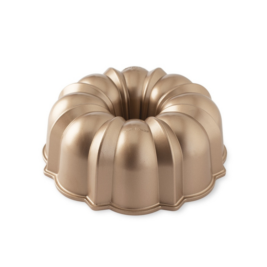 The original beloved Nordic Ware bundt design bakes elegant, picture-perfect cakes with ease in a shape loved by millions. Made of cast aluminum and a copper touch finish. This classic pan will make beautiful desserts that are sure to be conversation starters— with just the right splash of 50s nostalgia!