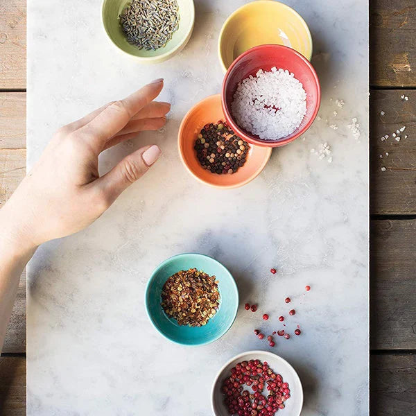 Set of six stoneware pinch bowls in six different Canyon colors! Made by Danica, this set of six pinch bowls are dishwasher-safe, microwave-safe, handy little helpers in the kitchen. 