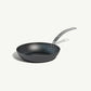 An 8-inch carbon steel frying pan with a gray surface and a stainless steel handle, pre-seasoned and ready for use on a white background.